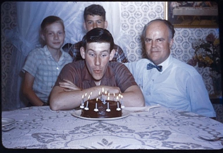 Ch. 15: Richie’s 14th birthday (friend Holly and me, behind). Dad had no idea that his sons would become cat burglars after the candles went out.